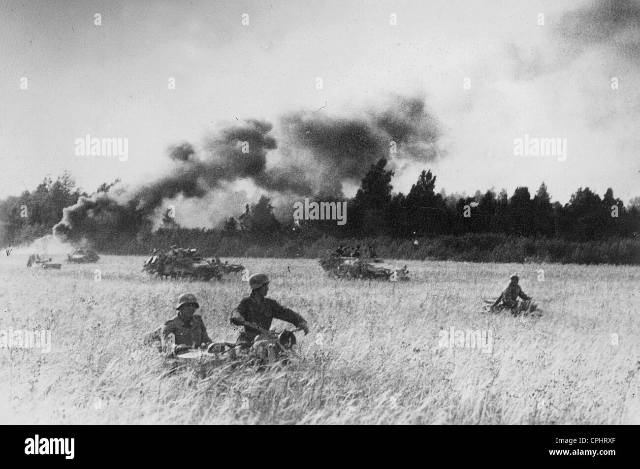 German motorcycle gunners and armored fighting vehicles, 1944 Stock Photo