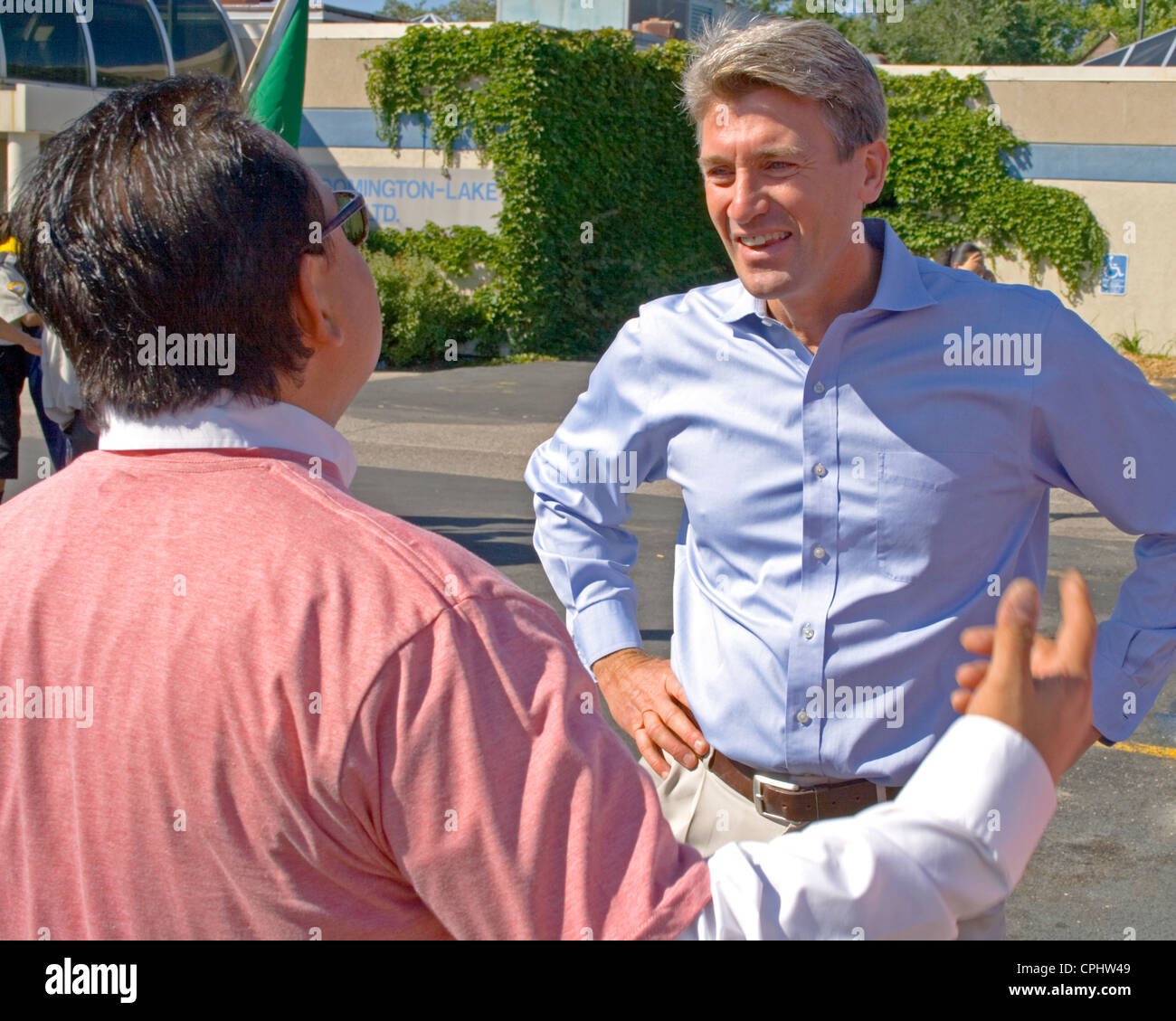 Minneapolis Mayor R. T. Rybak speaking to one of the leaders. Mexican Independence Day Minneapolis Minnesota MN USA Stock Photo