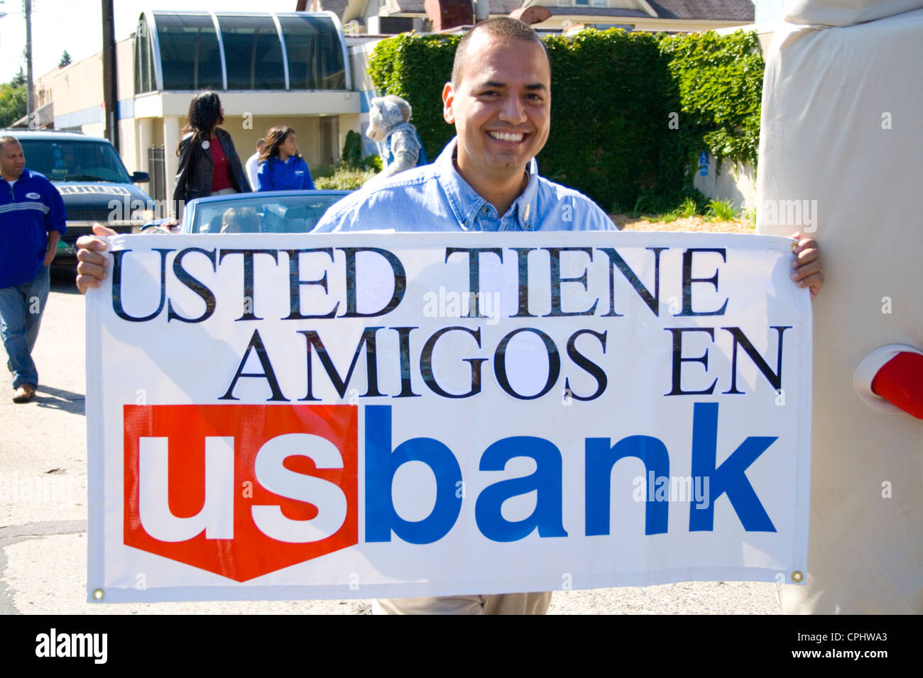 Man holding sign outside bank hi-res stock photography and images - Alamy