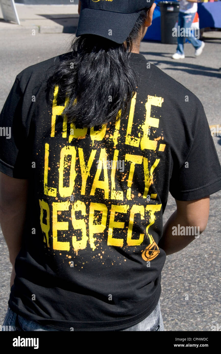 Mexican American teen wearing shirt printed with Habile Loyalty Respect. Mexican Independence Day Minneapolis Minnesota MN USA Stock Photo