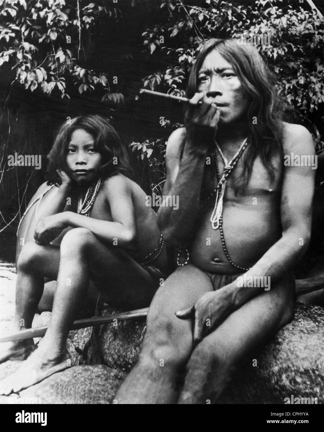 Smoking Oyana Indians, 1938 Stock Photo