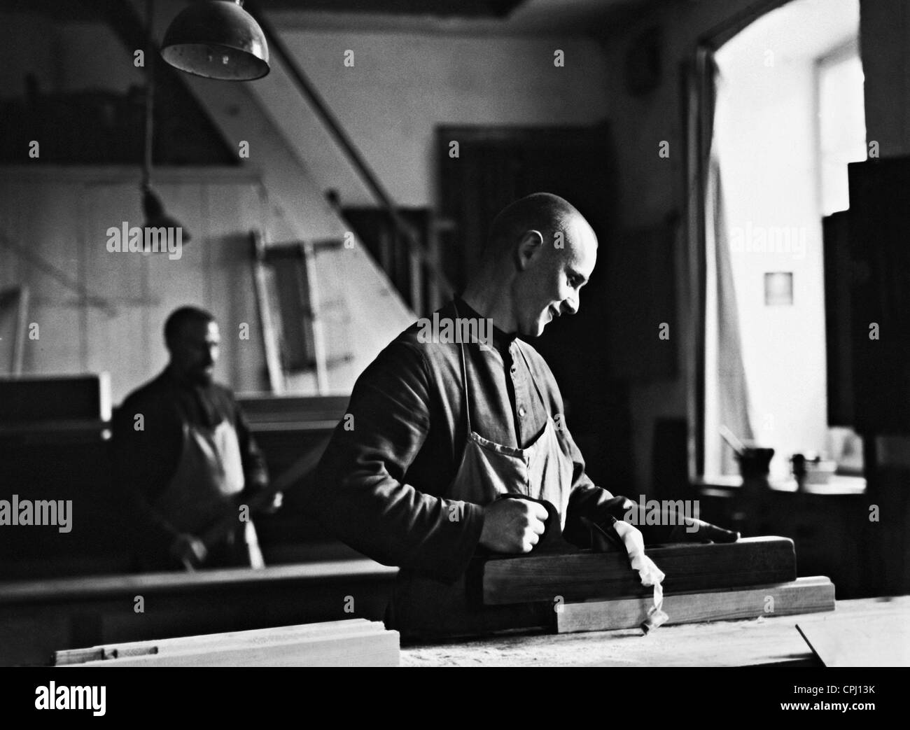 Lay brother of the Benedictine cloister in Maria Einsiedel working, 1931 Stock Photo