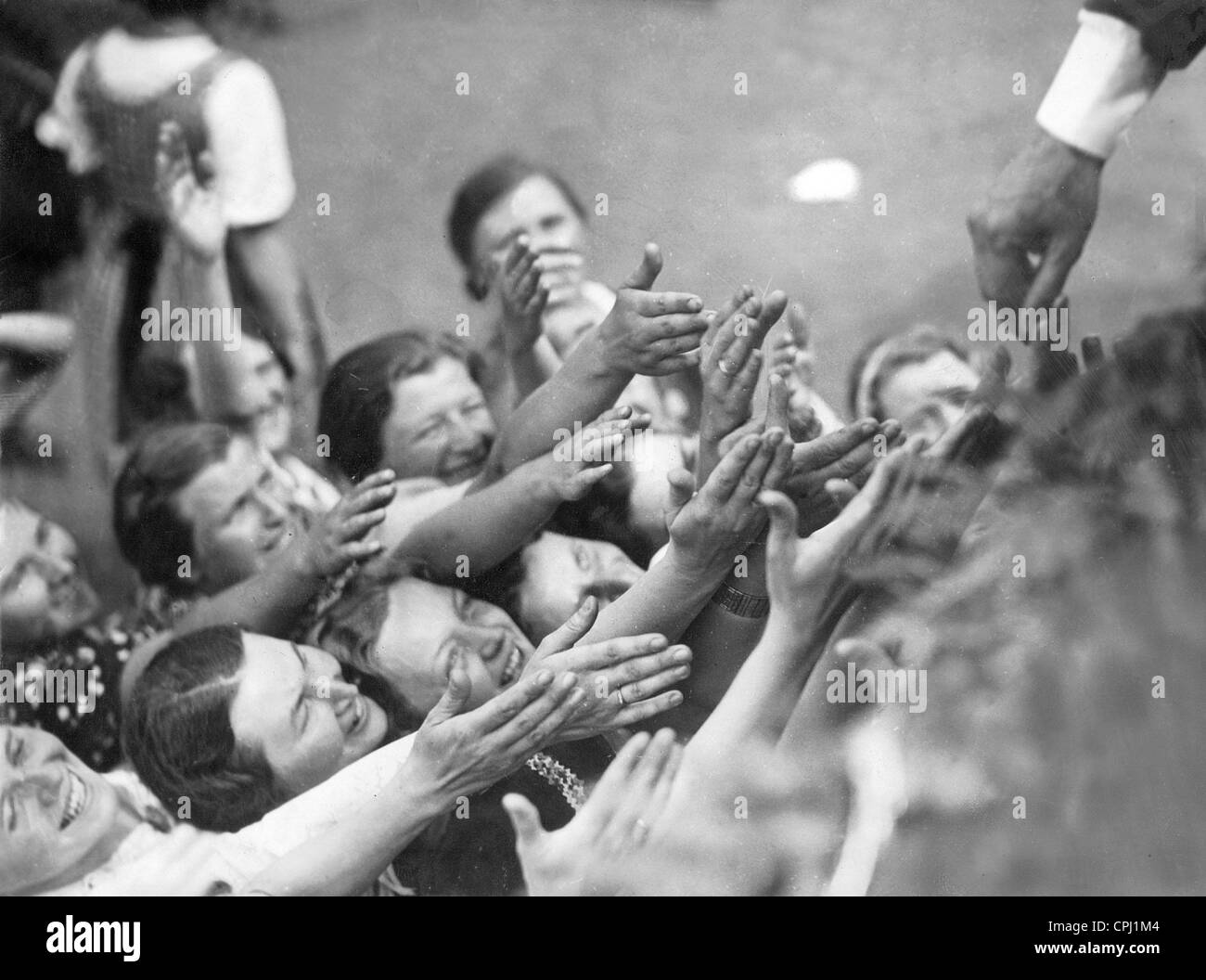 Women stretch their hands towards Adolf Hitler, 1938 Stock Photo - Alamy