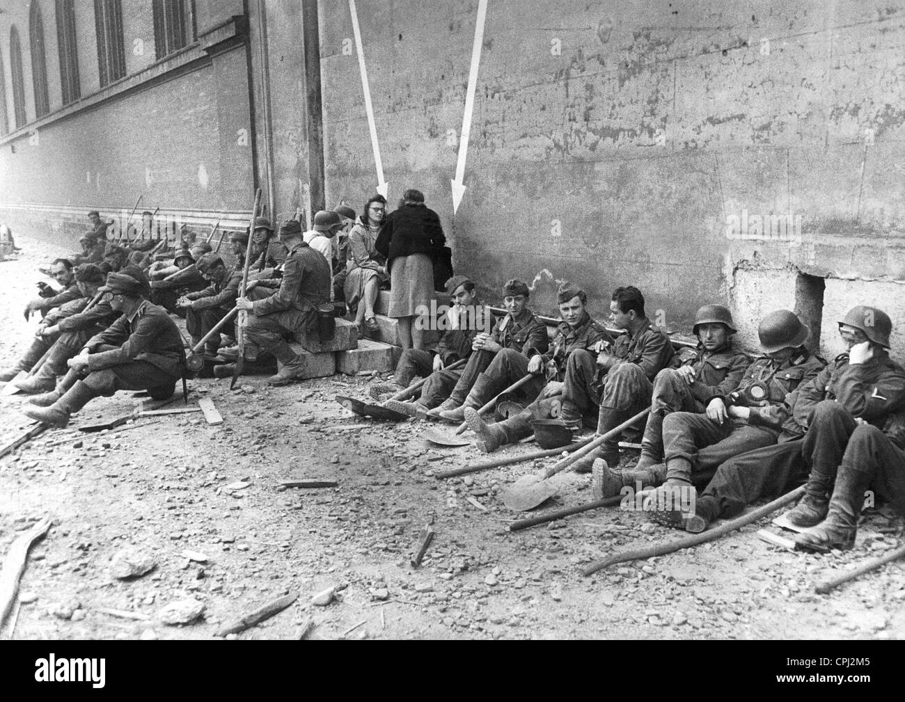 Volunteers have a break during clearing work in Munich Stock Photo