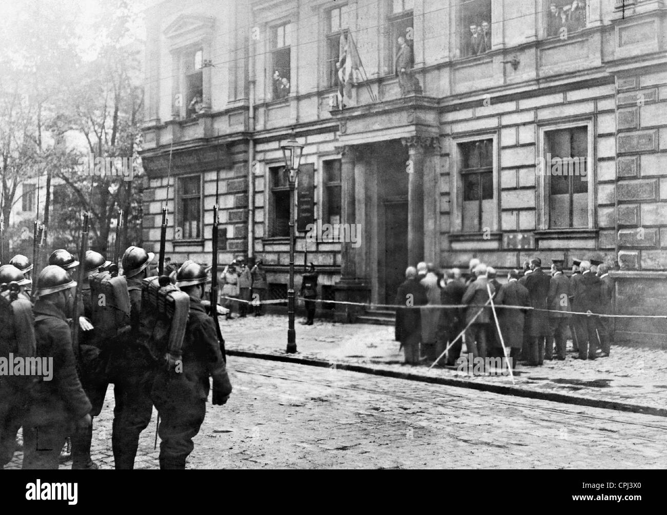 Hoisting of the flag in front of the house of the plebiscite commission in Katowice, 1920 Stock Photo