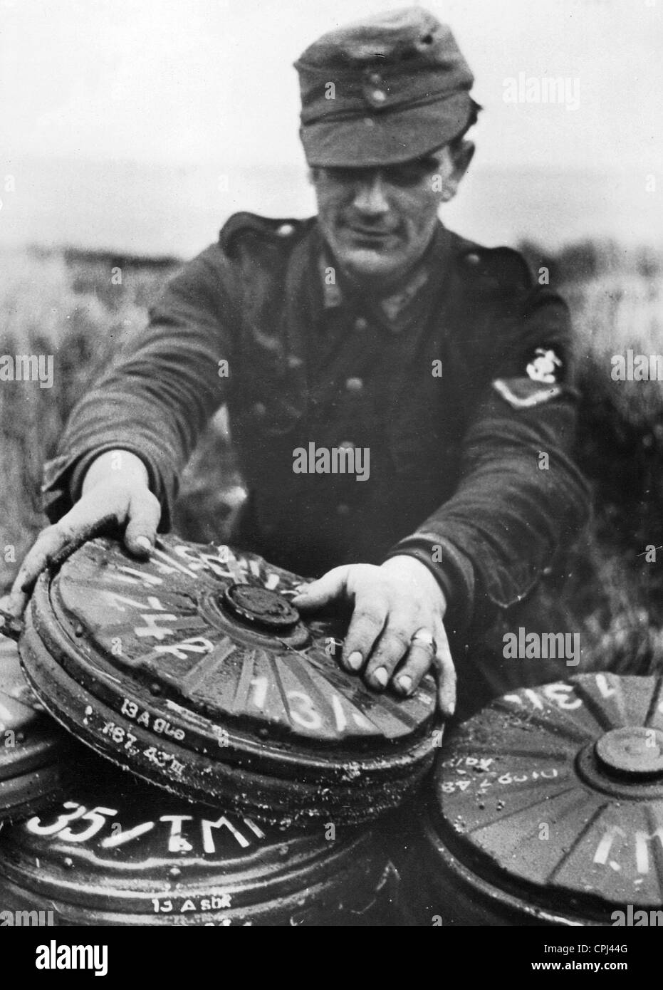 German soldier with mines, 1944 Stock Photo