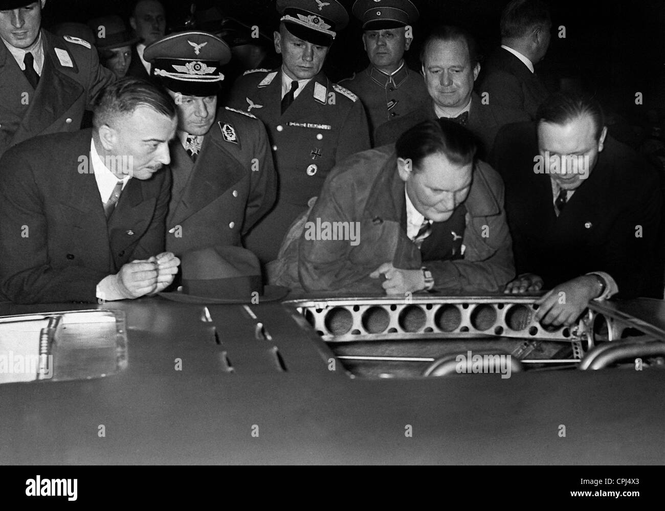 Wilhelm Kissel, Ernst Udet and Hermann Goering at a car show, 1937
