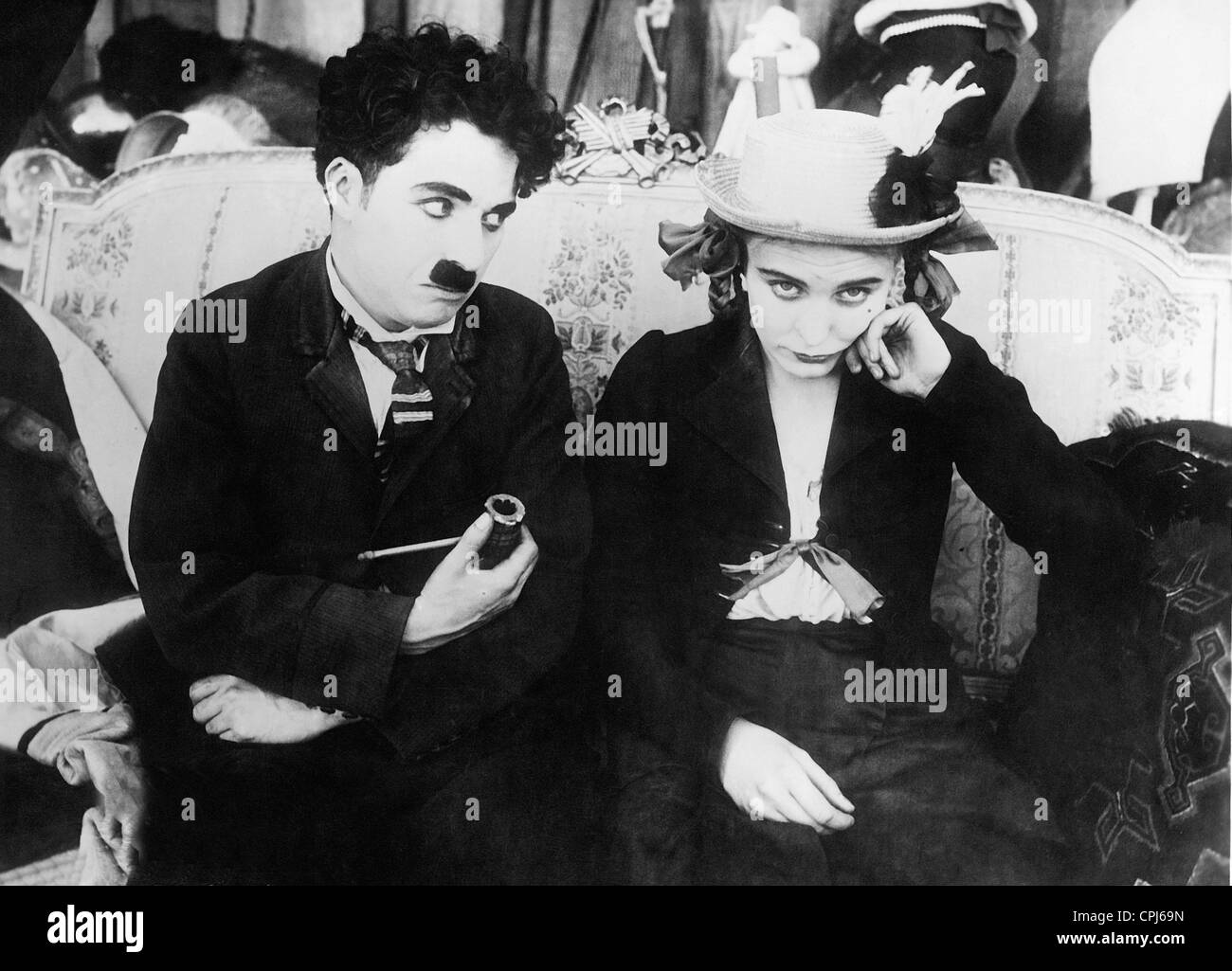 Charles Chaplin and Edna Purviance in 'Behind the Screen', 1916 Stock Photo