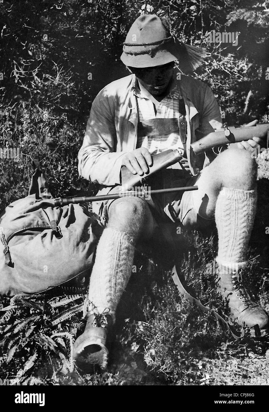 Poacher with carbine Stock Photo Alamy