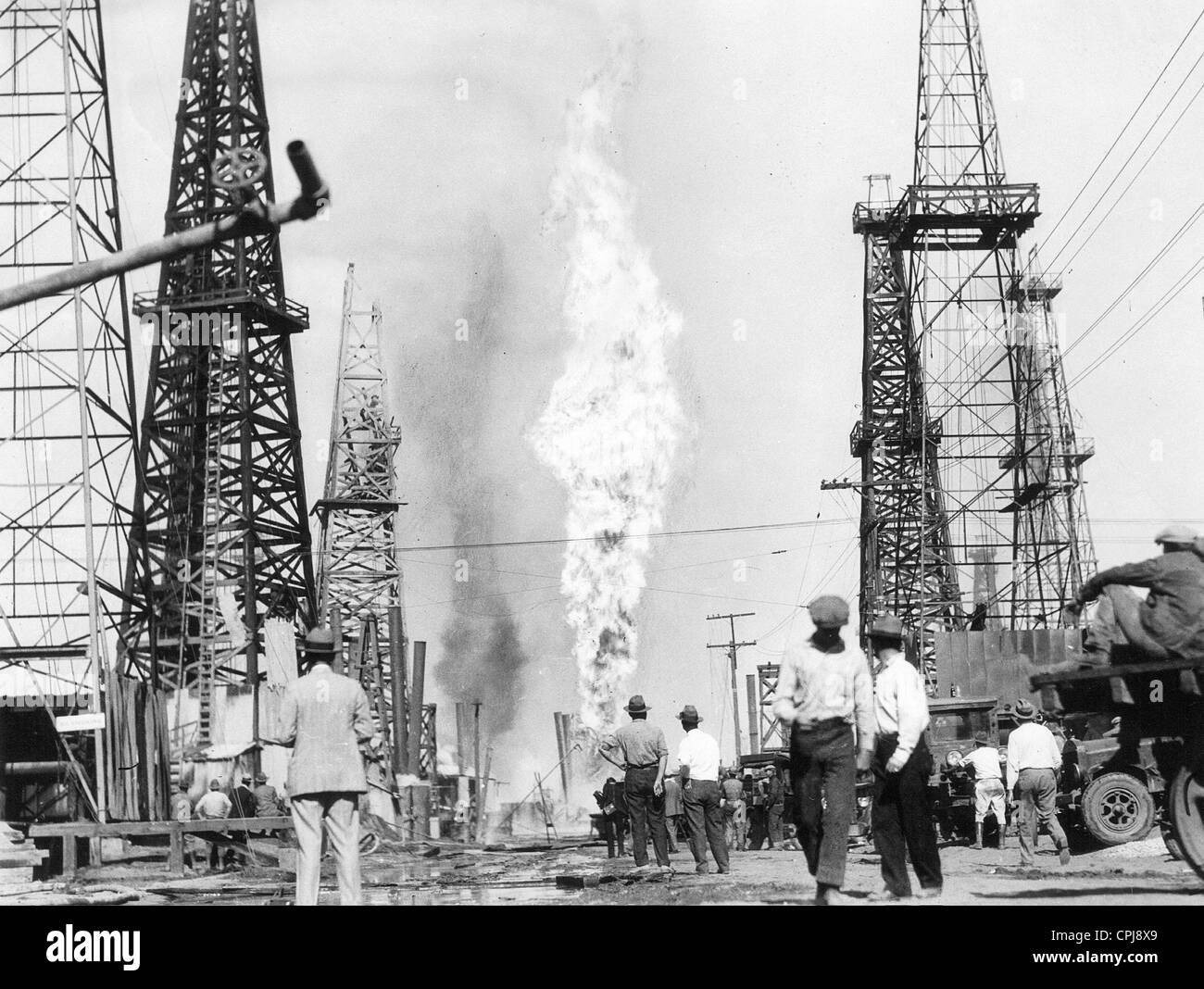 Burning oil well on an American oil field, 1928 Stock Photo Alamy