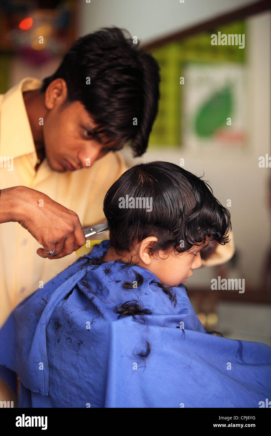 Nepali girl having a hair cut Stock Photo Alamy
