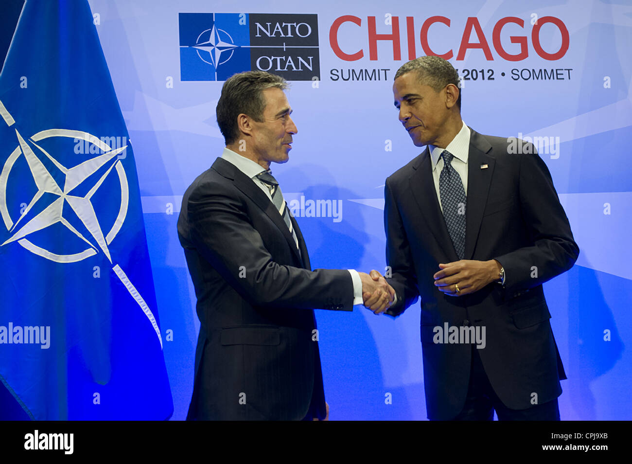 US President Barack Obama thanks NATO Secretary General Anders Fogh Rasmussen at the opening of the NATO Summit at the McCormick Place Convention Center May 20, 2012 in Chicago, Illinois. NATO leaders reached agreement on ending combat operations in Afghanistan. Stock Photo