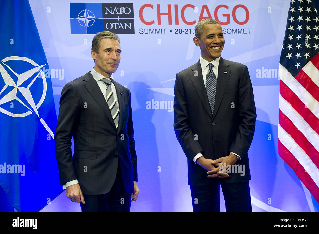 US President Barack Obama thanks NATO Secretary General Anders Fogh Rasmussen at the opening of the NATO Summit at the McCormick Place Convention Center May 20, 2012 in Chicago, Illinois. NATO leaders reached agreement on ending combat operations in Afghanistan. Stock Photo