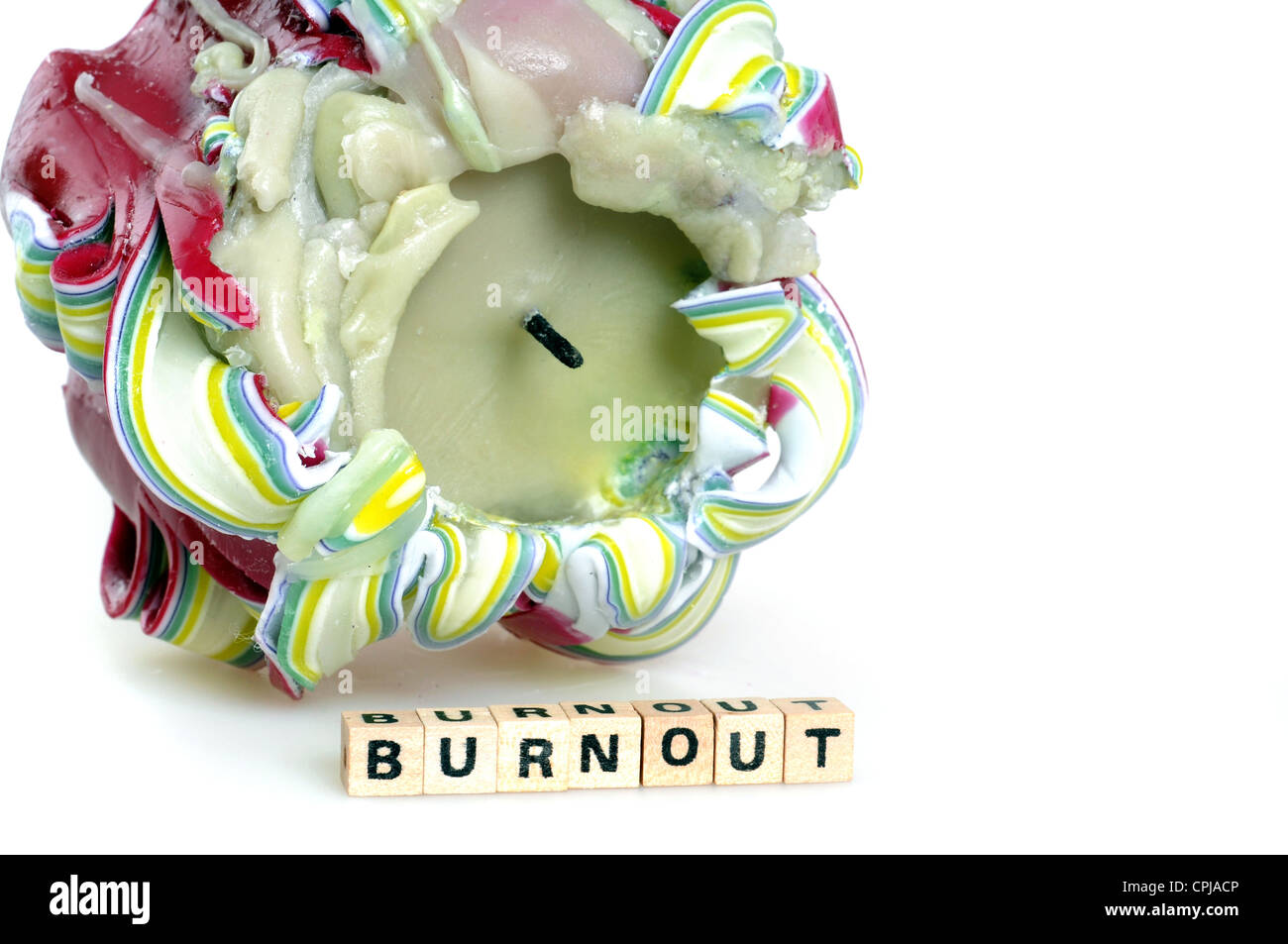 The word burnout in front of an old candle Stock Photo