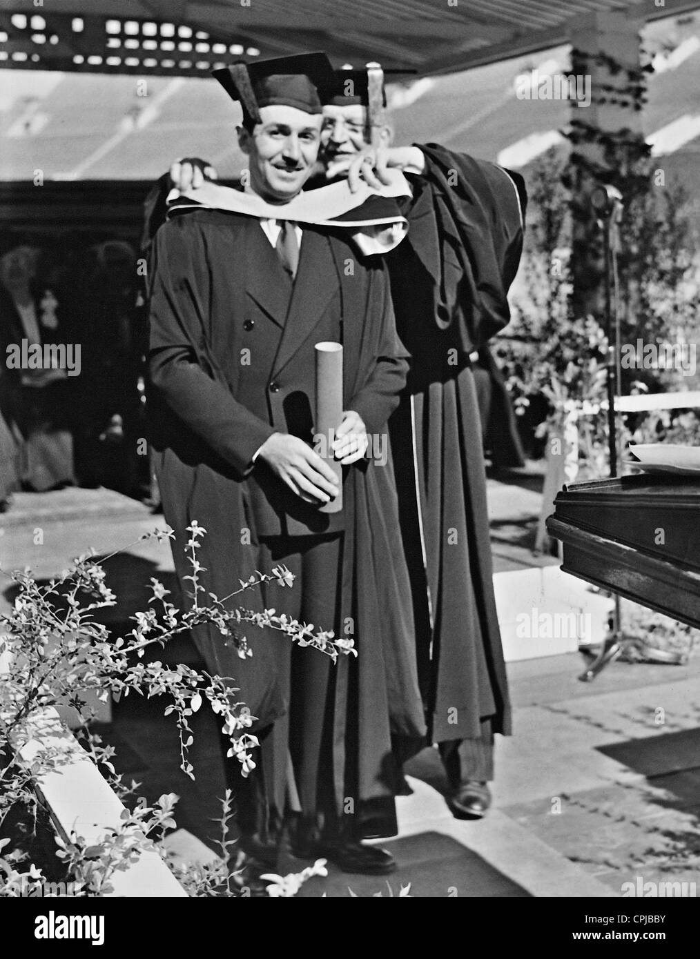 Walt Disney is awarded a doctorate by Rufus B. Kleinsmid, 1938 Stock Photo