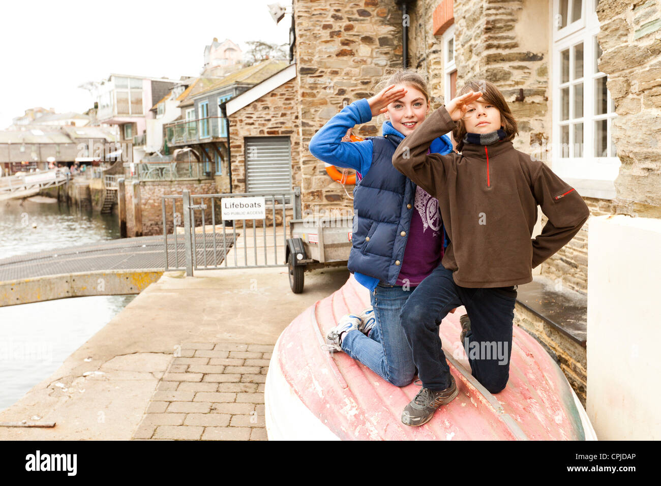 children sitting on boat Stock Photo