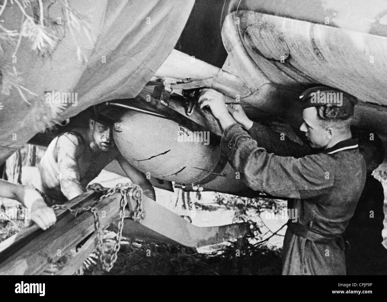 German ground crew loads a Stuka with bombs, 1941 Stock Photo