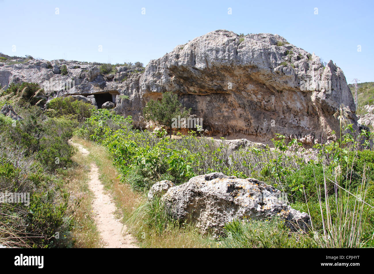 Caves at Cala Morell Necropolis archaeological site, Cala Morell, Menorca, Balearic Islands, Spain Stock Photo