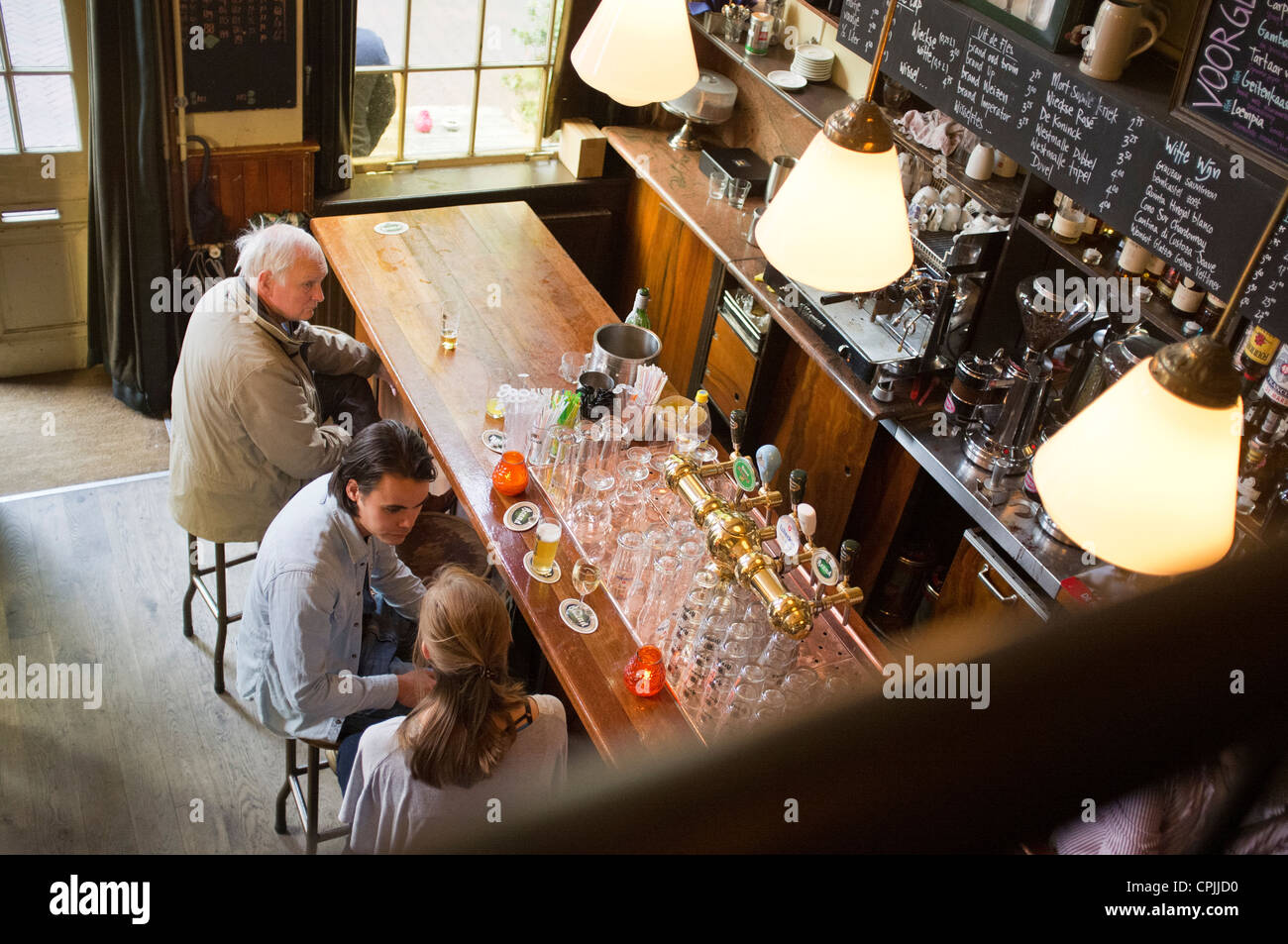 People sat a bar in the Dutch town of Delft Stock Photo