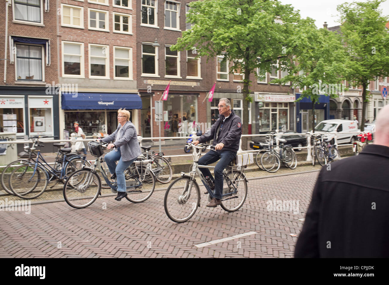 Cycling in the Dutch town of Delft Stock Photo