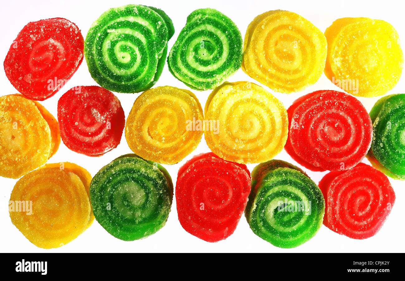 red green yellow fruit drops over white Stock Photo
