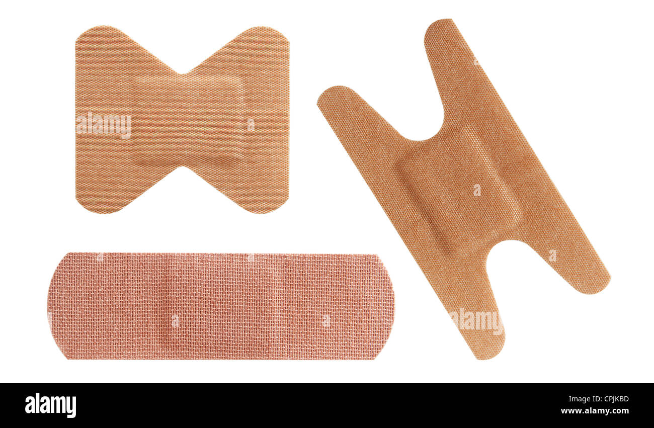 Set of three bandaids or bandages in various shapes over white Stock