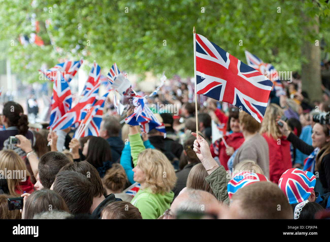 Spectators waiting for the arrival of the wedding procession of Prince