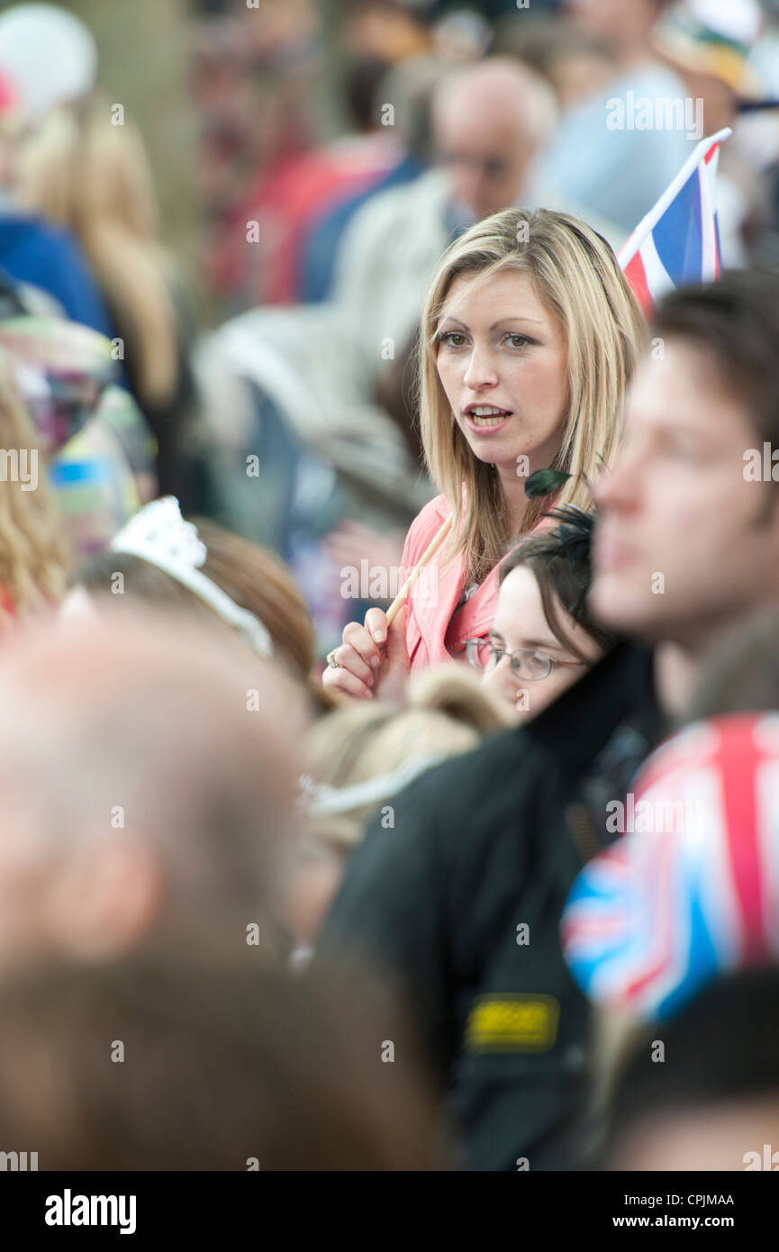 Spectators waiting for the arrival of the wedding procession of Prince William and Kate Middleton in London. Stock Photo