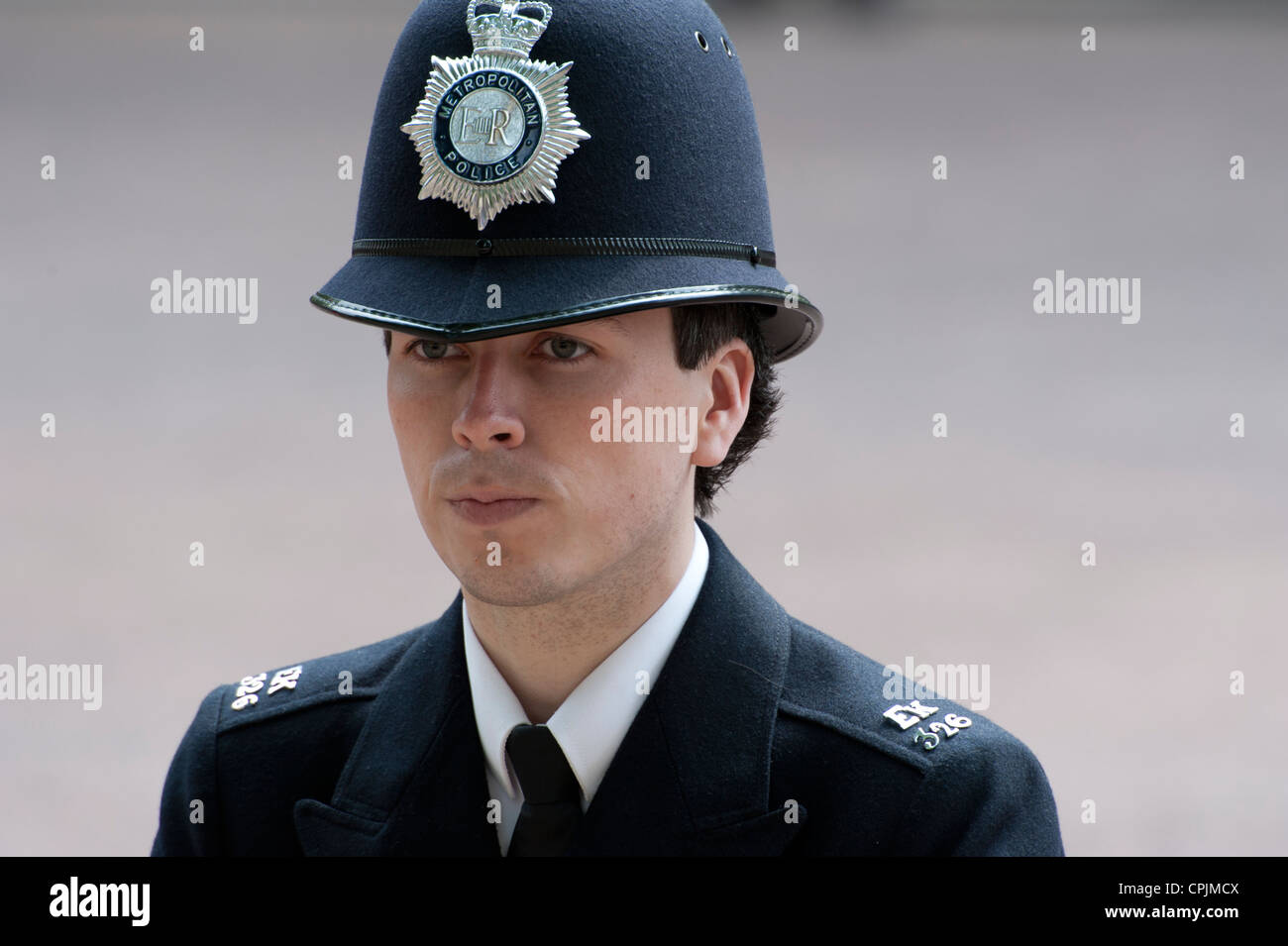 British police constable stands guard on London's The Mall during the wedding of the Duke & Duchess of Cambridge. Stock Photo