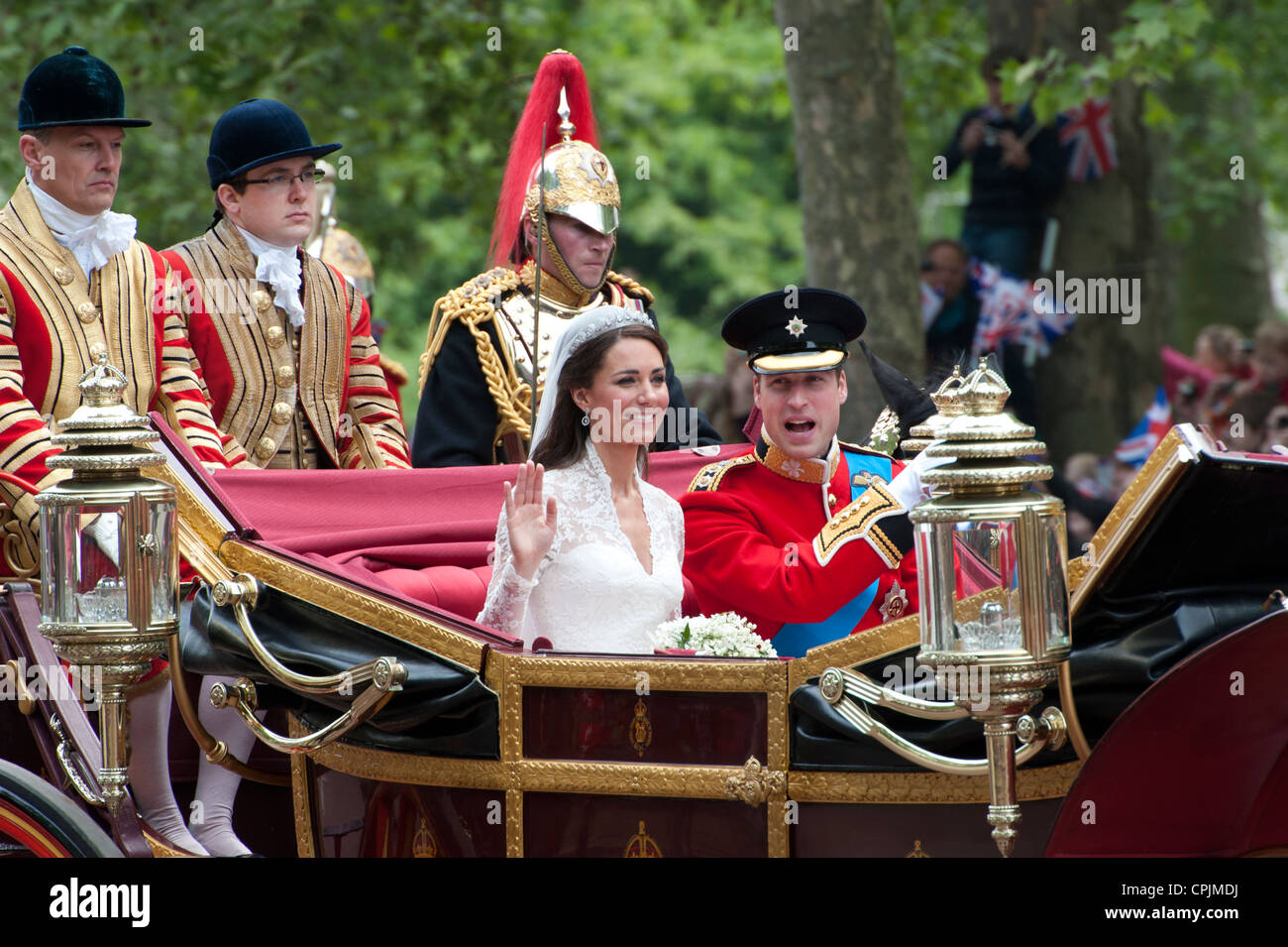 Prince William and Catherine Middleton ride in a carriage down The Mall