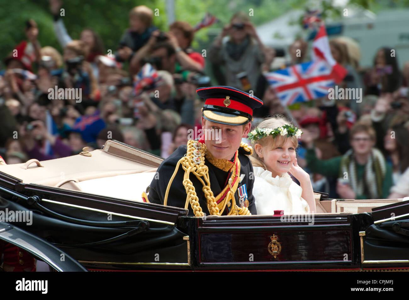 Prince Harry rides in a carriage at the wedding of his brother Prince William to Catherine Middleton Stock Photo