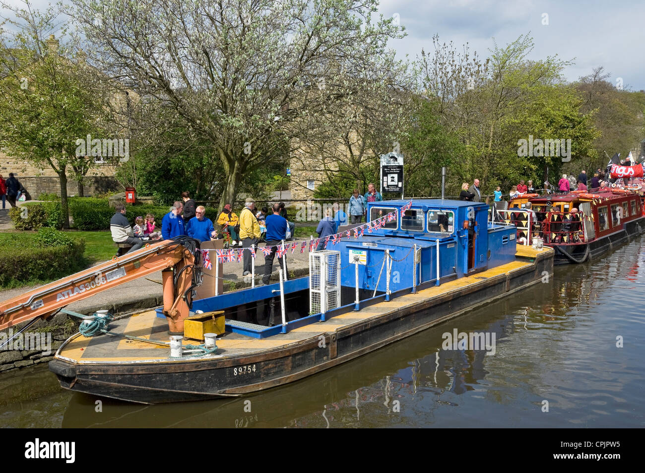 Canal dredger barge with crane Skipton North Yorkshire England UK