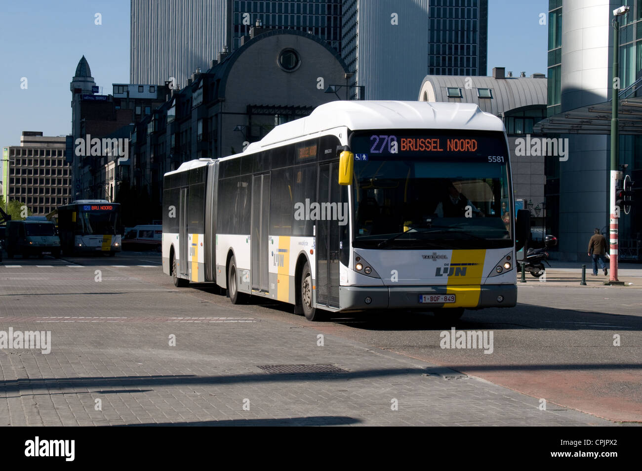 A Van Hool AG300 articulated bus arrives at the bus station by Gare de Nord station in Brussels. It is operated be De Lijn Stock Photo - Alamy