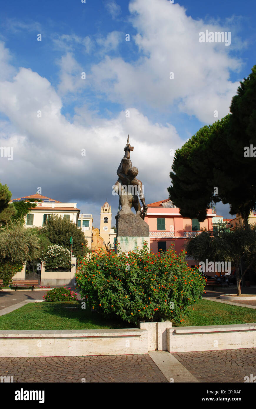 Colorful houses, statue and park, Spotorno, Liguria, Italy Stock Photo