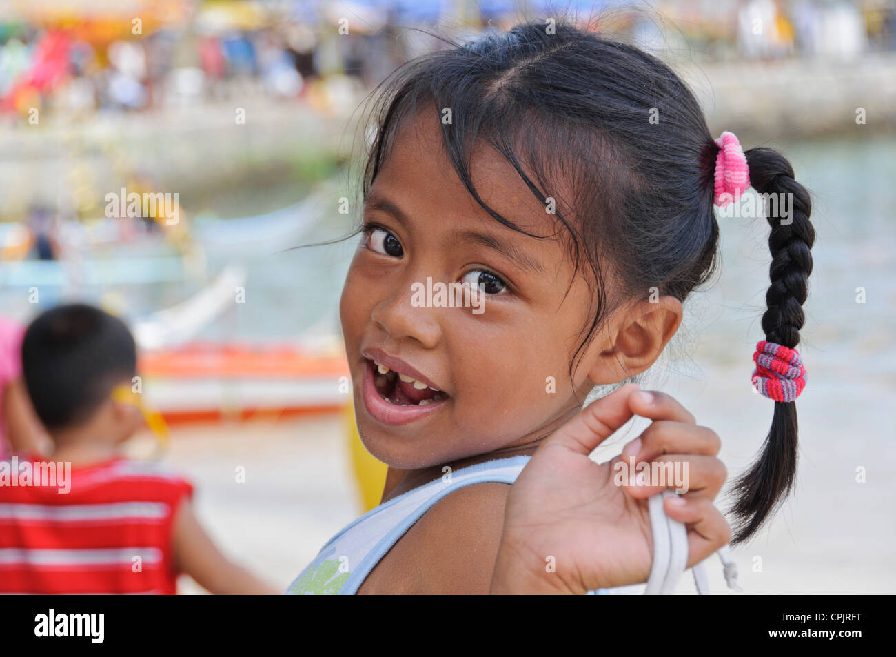 Pretty Smiling Little Asian Girl With Milk Teeth Diastema Tooth Gap Braided Ponytail Hair Sabang Puerto Galera Philippines Asia Pretty Smiling Little Asian Girl With Milk Teeth Diastema Tooth Gap Braided Ponytail Hair Sabang Puerto Galera Philippines Asia