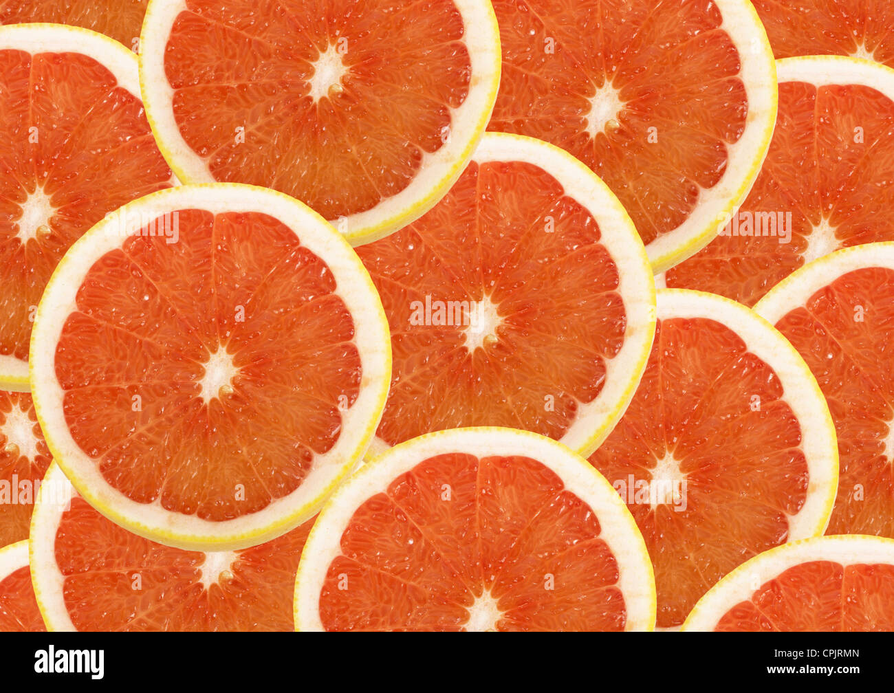 fresh grapefruit and slices background Stock Photo Alamy