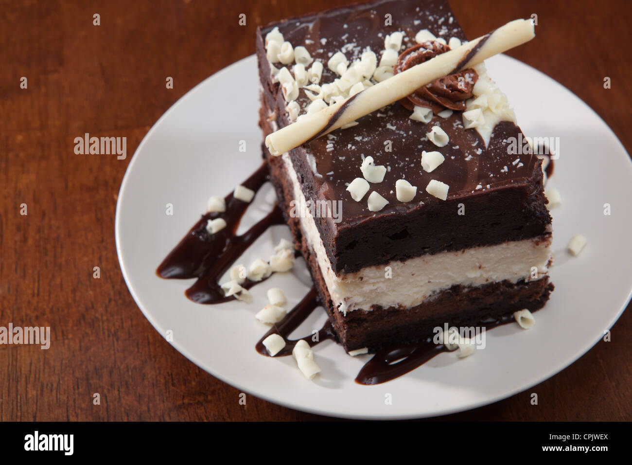 Chocolate mousse cake layered with decadent marscapone, white chocolate, dark chocolate and syrup. Stock Photo