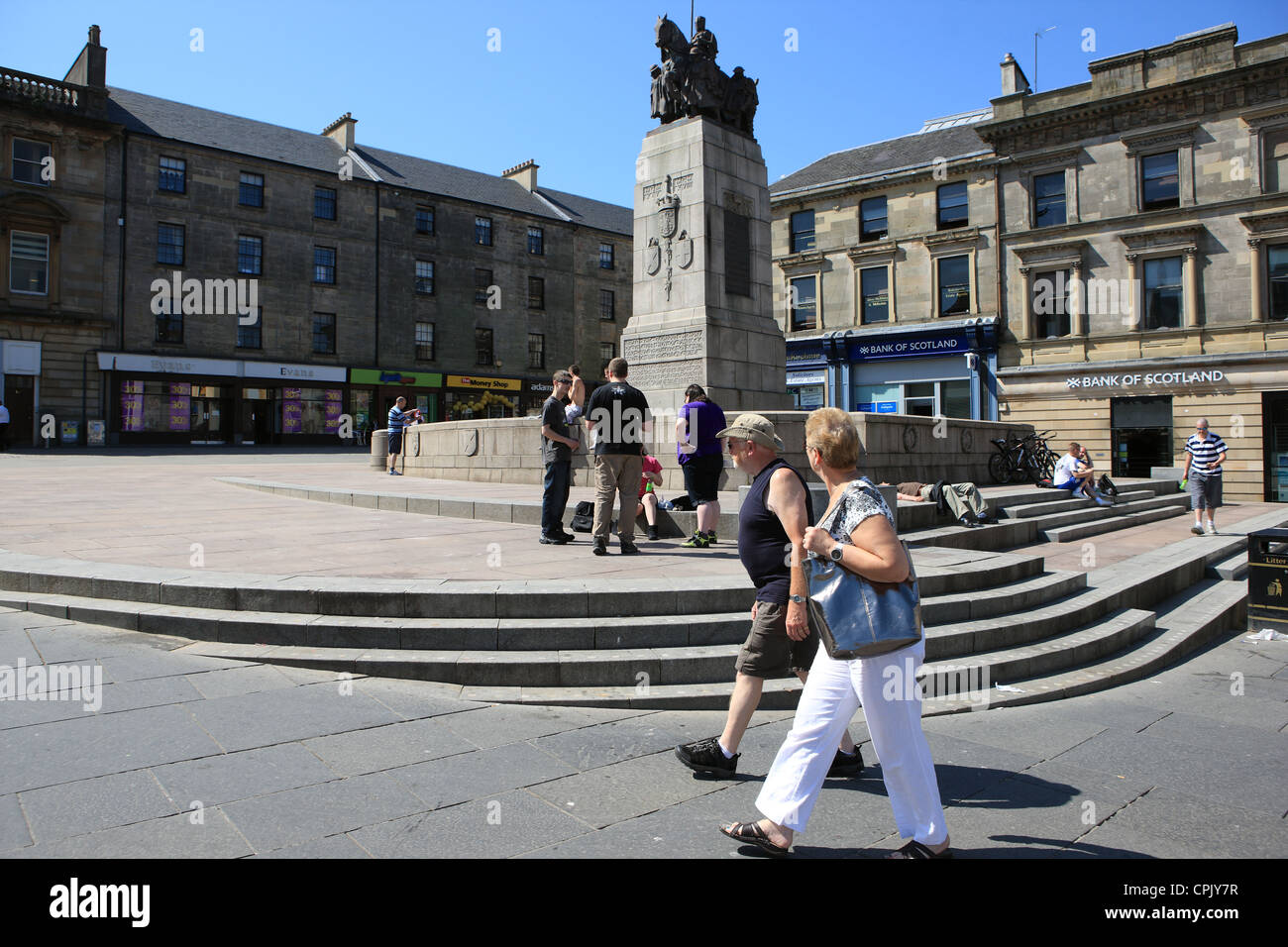 People milling around at the Cenotaph at Paisley Cross in Renfrewshire