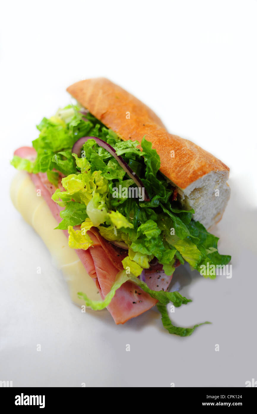 Foods an Italian hoagie sub with deli meats and lettuce and onion on a baguette or sub roll Stock Photo