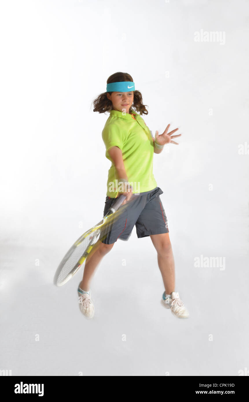 Junior tennis players showing their technique. Stock Photo