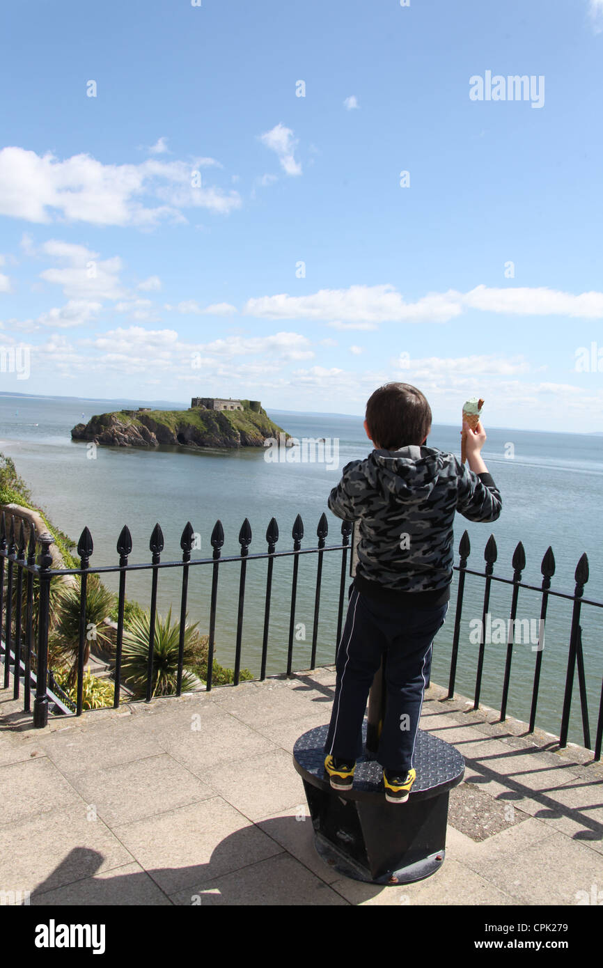 Child in Tenby looking out to St Catherines Island Stock Photo Alamy