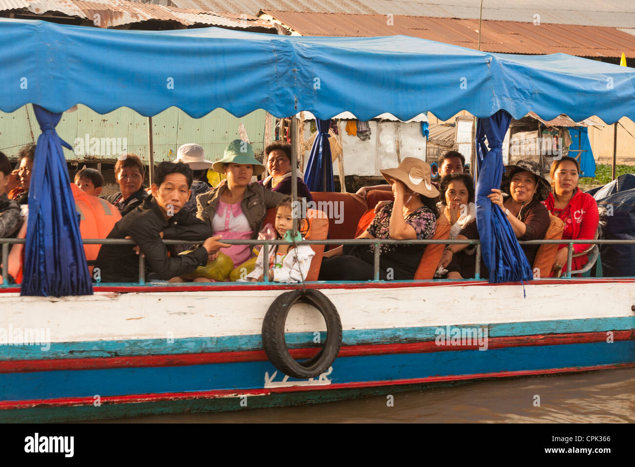 Local people on a boat in the floating market, Cai Rang near Can Tho, Mekong River Delta, Vietnam Stock Photo