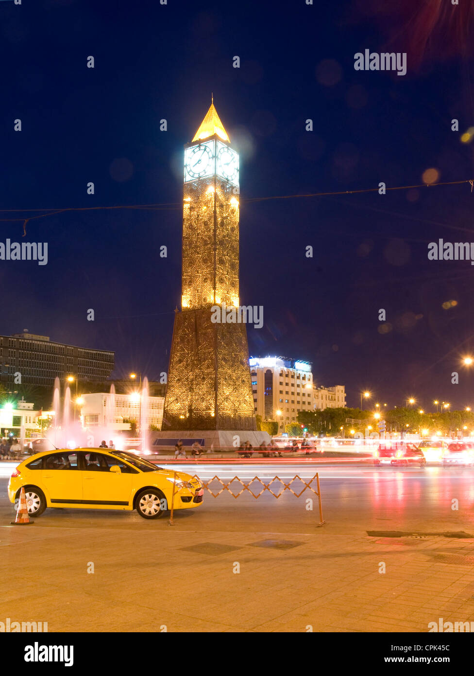 Clock Tower ave Habib Bourguiba Ville Nouvelle Tunis Tunisia Africa taxi with night light streaks Stock Photo
