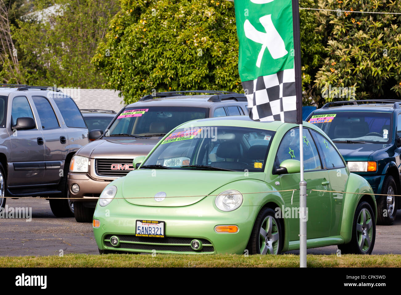 VW beetle on a used car sales lot - California USA Stock Photo