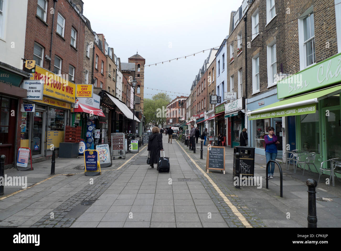 Woman walking along Exmouth market Islington London England UK KATHY ...