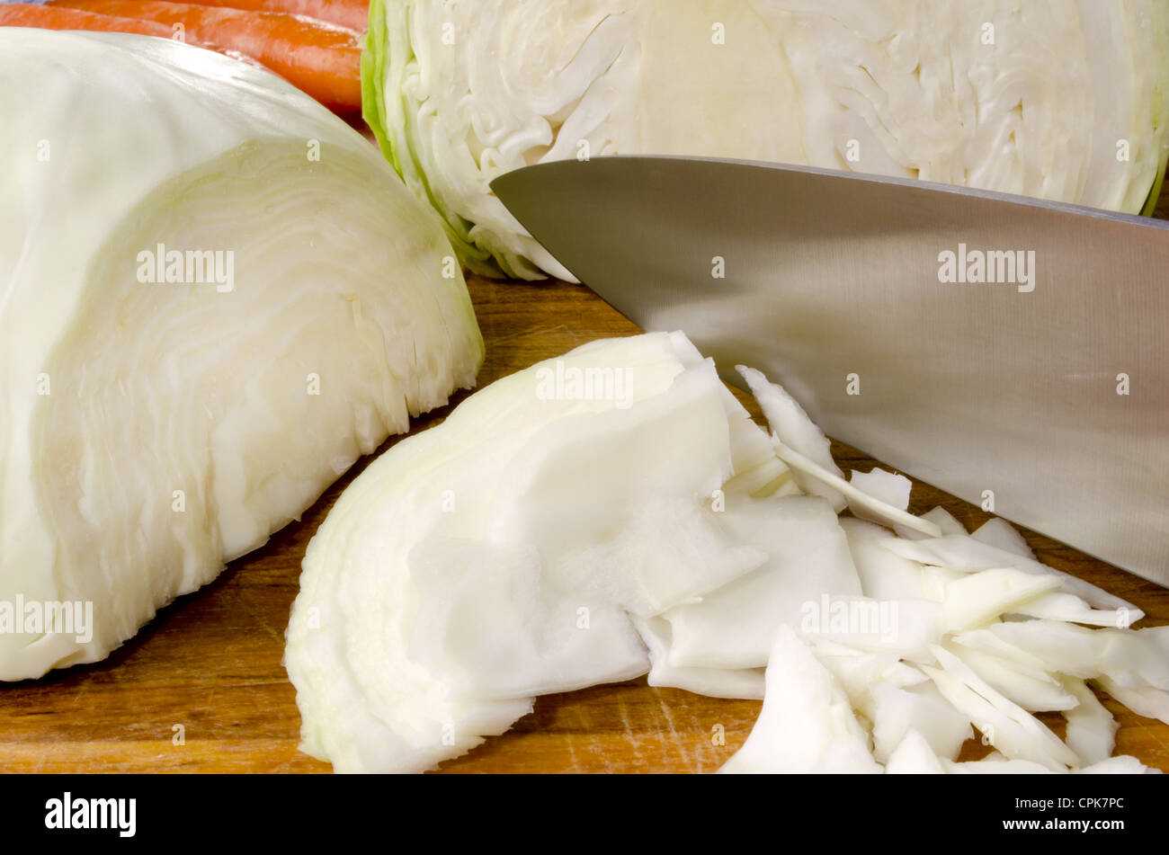 organic white cabbage is grated to make irish coleslaw Stock Photo