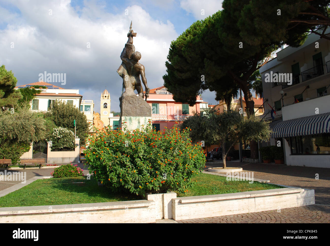 Colorful houses, statue and park, Spotorno, Liguria, Italy Stock Photo