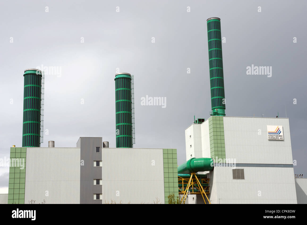 State of the art combined-cycle gas-fired power station fitted with solar energy panels in the chimney stacks Stock Photo