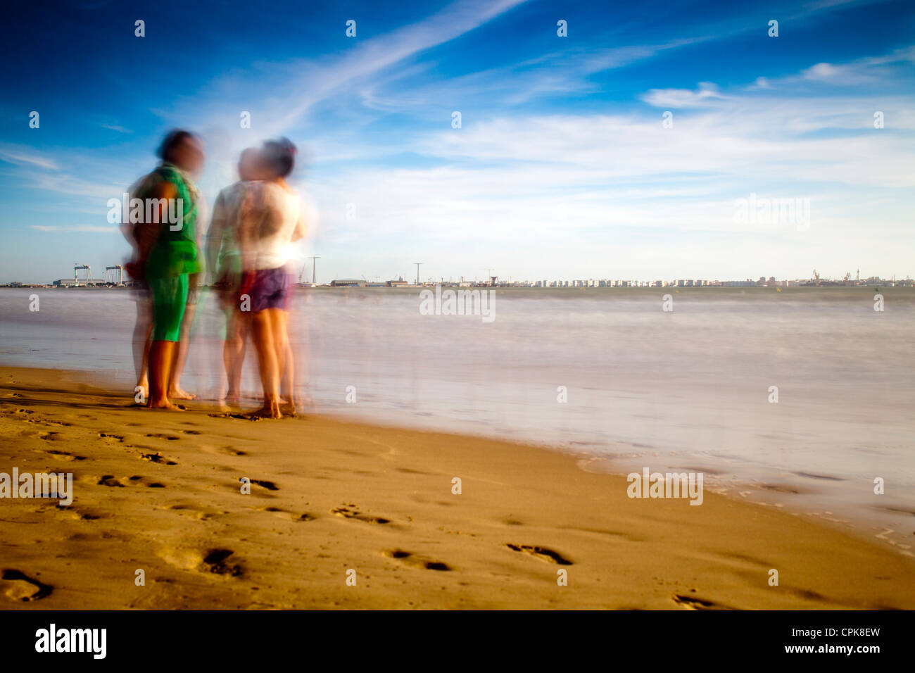 People on the beach. Daylight long exposure shot by the use of neutral