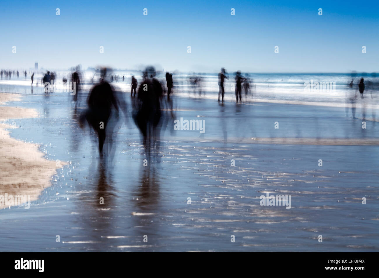 People on the beach. Daylight long exposure shot by the use of neutral
